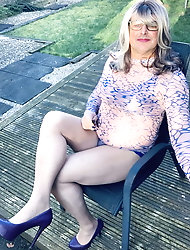Crossdresser Kellycd in blue and pink see thru dress