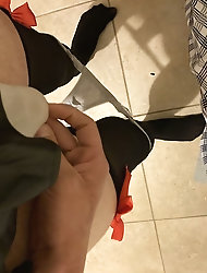 High heel sandals and black hold-up stockings.